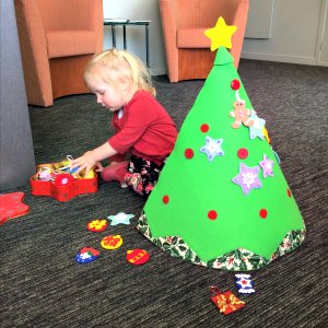 Cassie decorating her felt Christmas tree