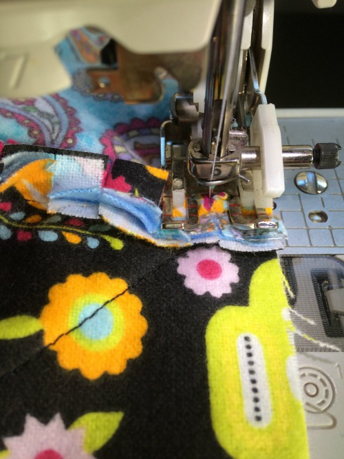 Close up of sewing over block seams
