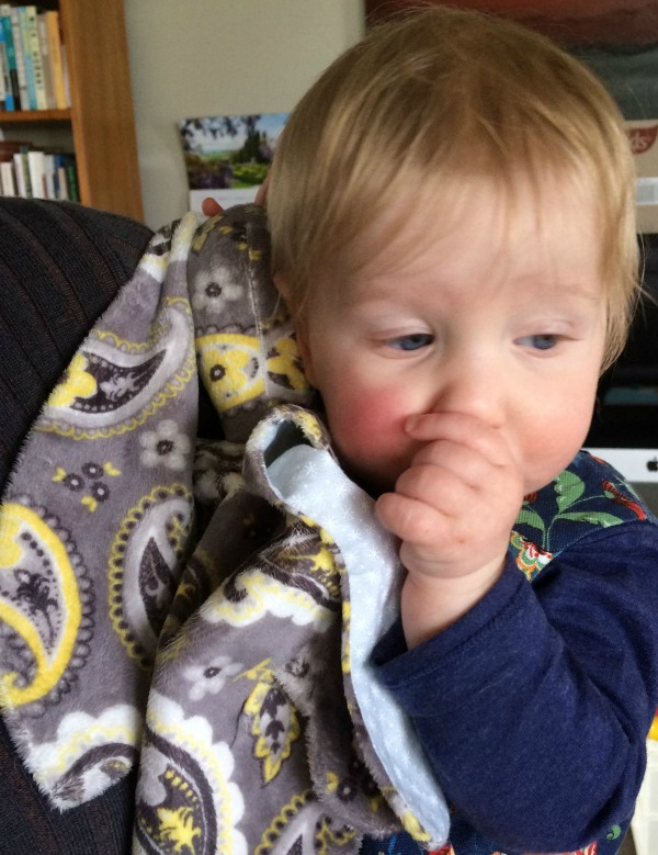 Baby holding bunny head