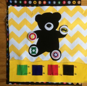Busy book Super Ted with 4 super hero emblems