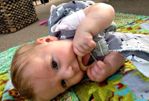 Baby with wooden teether ring