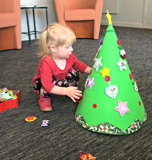 Cassie decorating her felt Christmas tree