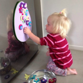 Cassie (16months) decorating the felt Easter egg while big sisters are away