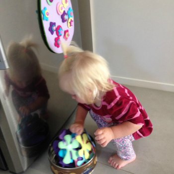 Cassie (16months) decorating the felt Easter egg while big sisters are away