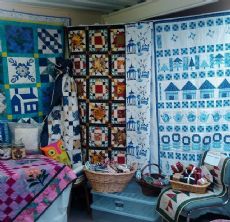 quilts hanging in Quilters Dream quilting shop Quilters Dream