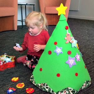 Cassie decorating her felt Christmas tree